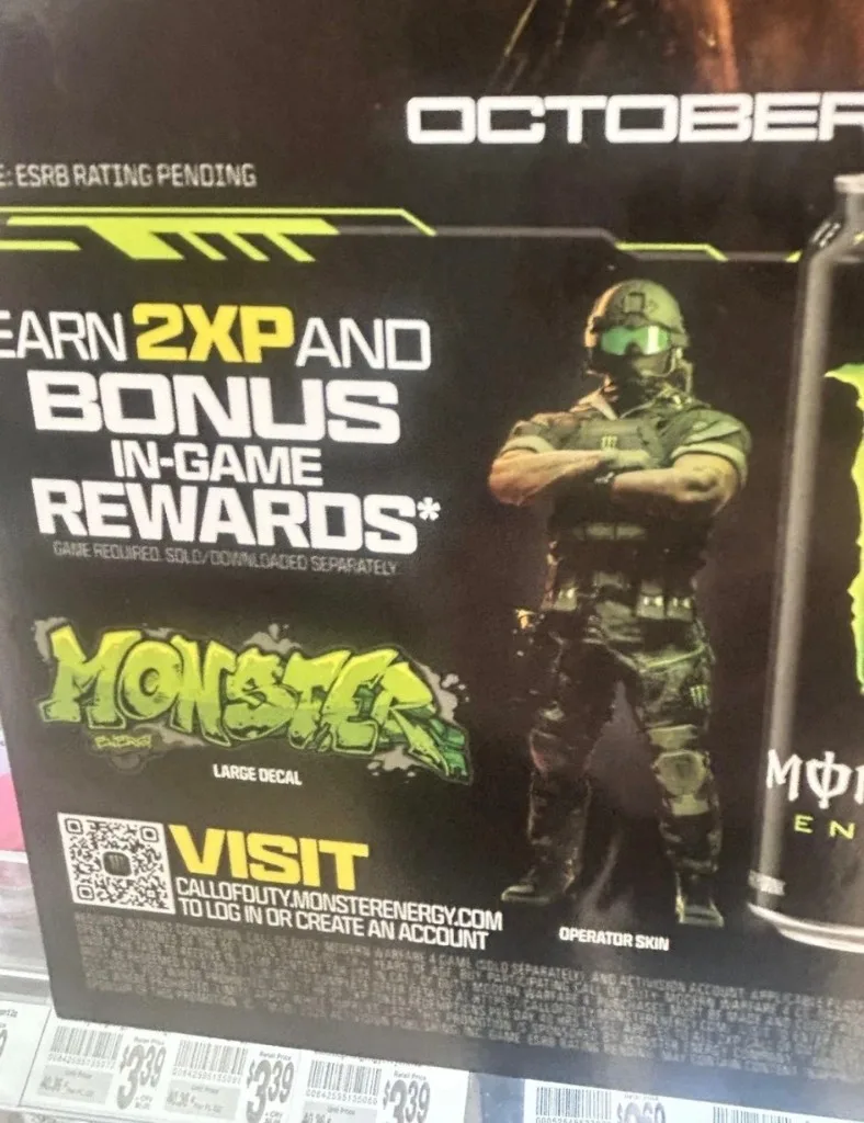Retail display for the Monster Energy Modern Warfare 4 promotion showing an Operator skin and a Large Decal, with 2XP and bonus in-game rewards